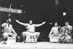 Yokozuna Akebono performing ancient ceremony 
wearing a heavy hemp belt